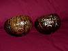2 coconut cups signed by Dawn Wells. One is titled Aloha and the other S.O.S