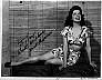 Jane "Poni"Adams, black & white publicity photo. Leggy reclining pose