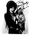 Cassandra Peterson 8x10 b/w print from 1988 movie "Elvira, Mistress of the Dark". Shown holding her dog