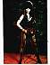 Cassandra  "Elvira" Peterson 8x10 b/w print from 1988 movie "Elvira, Mistress of the Dark". Shown dirty in torn pantyhose & holding rocket launcher